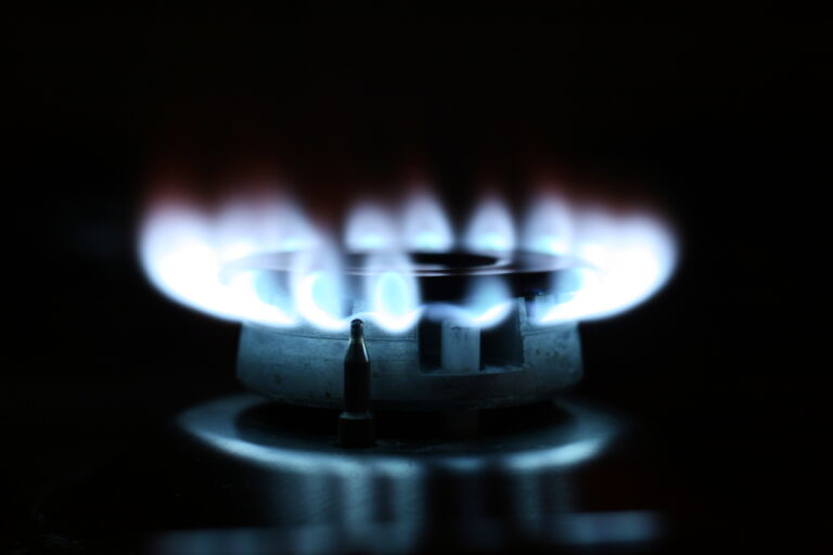 A gas stove burner that is on