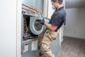 man conducting commercial hvac repairs in greenville sc